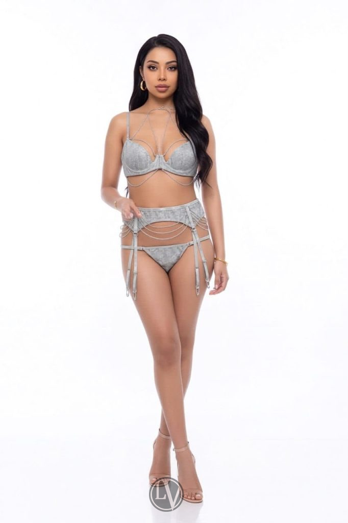 Priti displays a natural blend of sensuality and grace in her captivating pose.