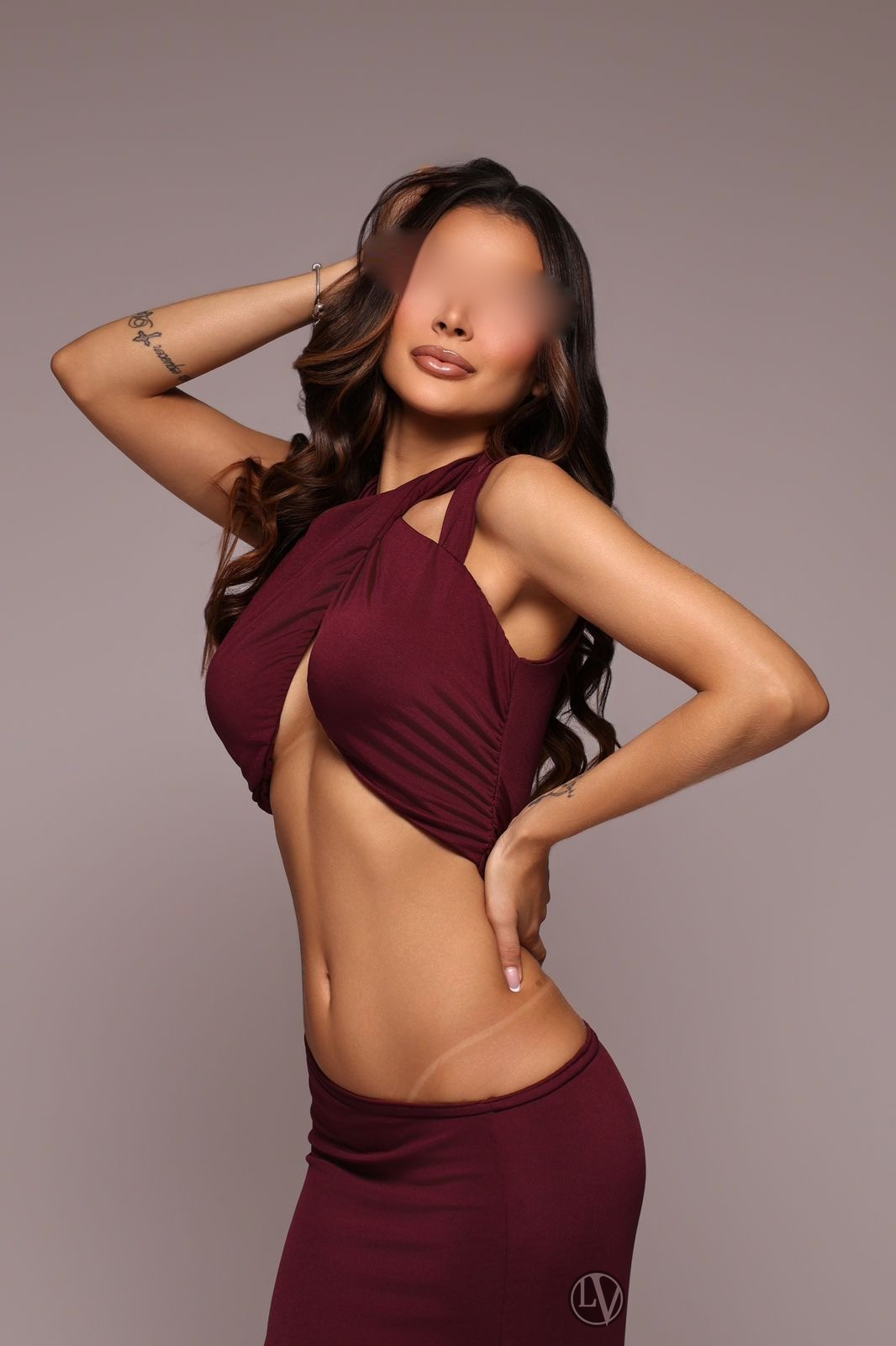 Danielle has a charming smile that beautifully enhances her natural features.