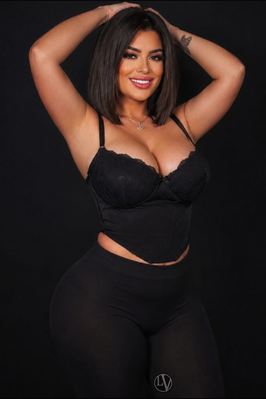 This elegant female enchants the camera with her alluring pose.