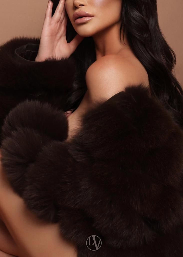 A captivating escort radiating grace in her stunning gallery images.