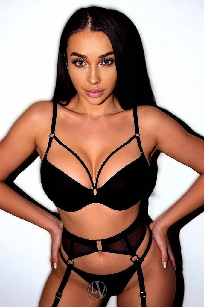 An enchanting companion captivates with her graceful and alluring presence.