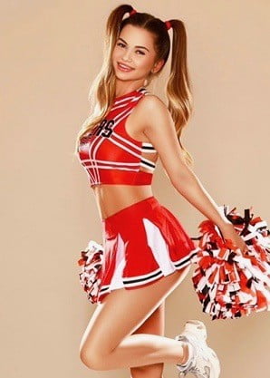 Petite Noelle dressed in her sexy outfit for her London escort photoshoot